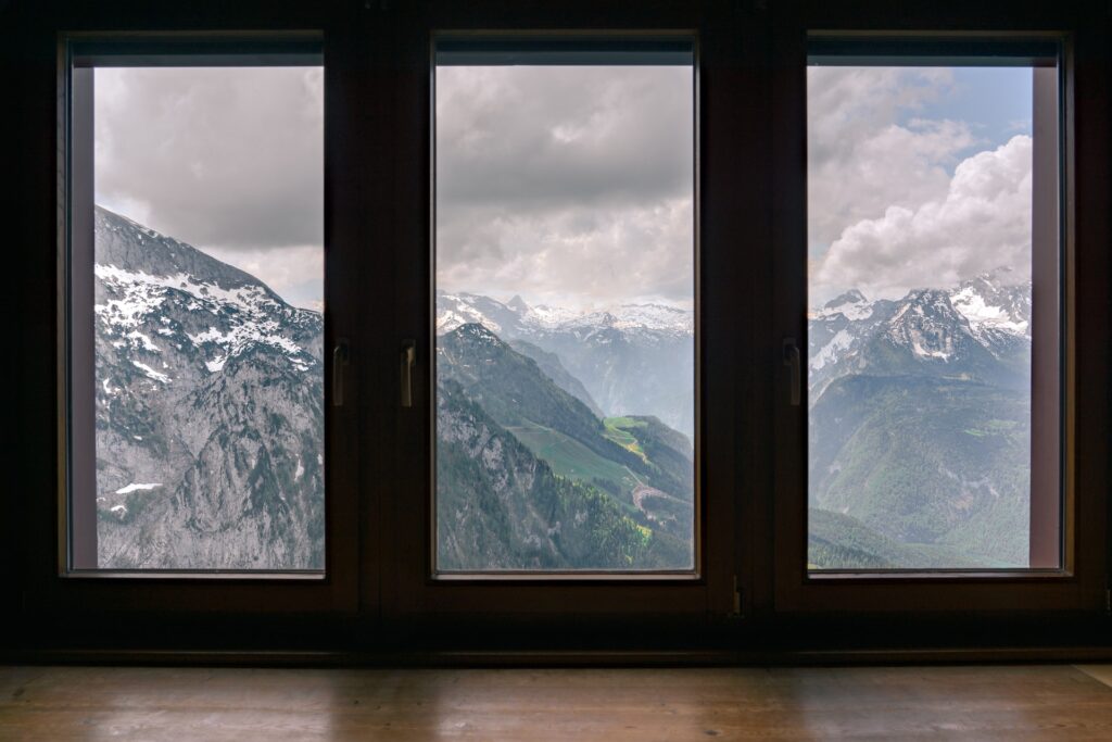 Snow-covered mountains through windows