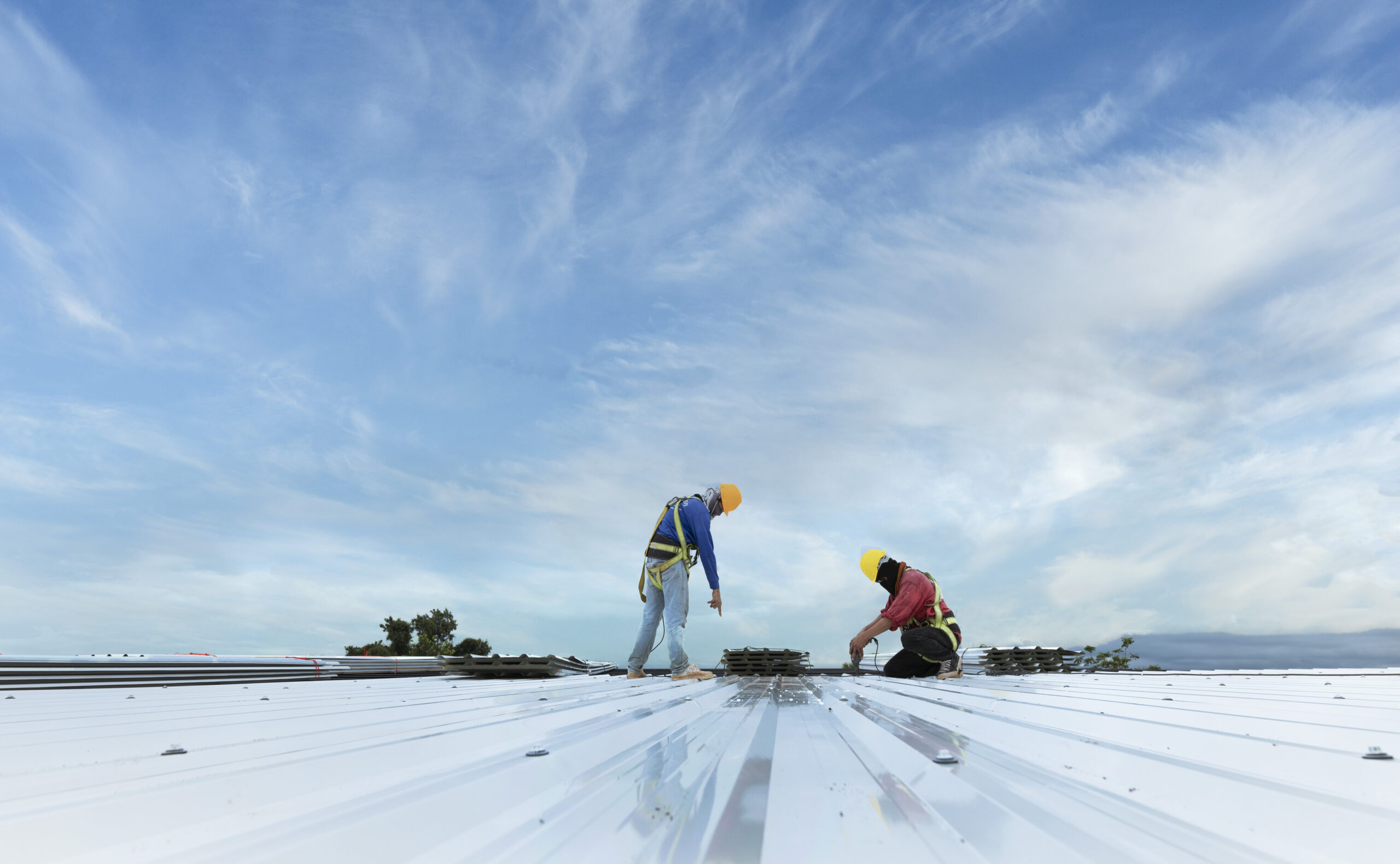 Commercial roof repair contractors falcon heights mn - roofers working on a commerical roof